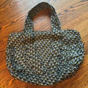 Dounia blue bird (dodo bird?) quilted large tote. Wide straps, exterior pockets.